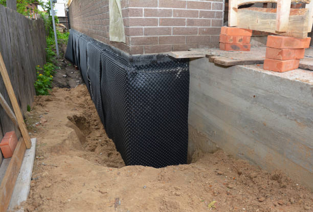 Happy homeowners after waterproofing job in Eminence